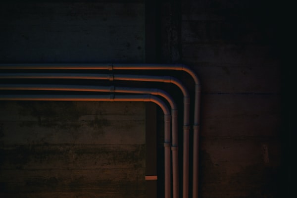 Pipes connected to wall for plumbing installation